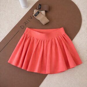 Aritzia TNA Move High Rise Pleated Tennis Skort Coral/Peach Size Small